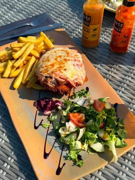 Aussie parmi with chips and salad in the beer garden